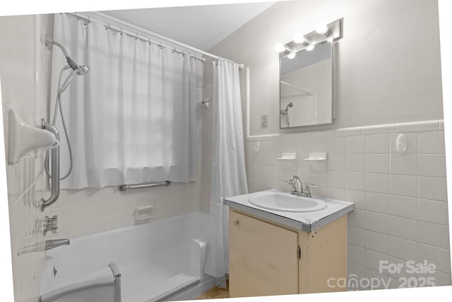 1520 21st Ave NE, Hickory, NC 28601 - bathroom featuring shower / bath combination with curtain, vanity, tile walls, and a wainscoted wall