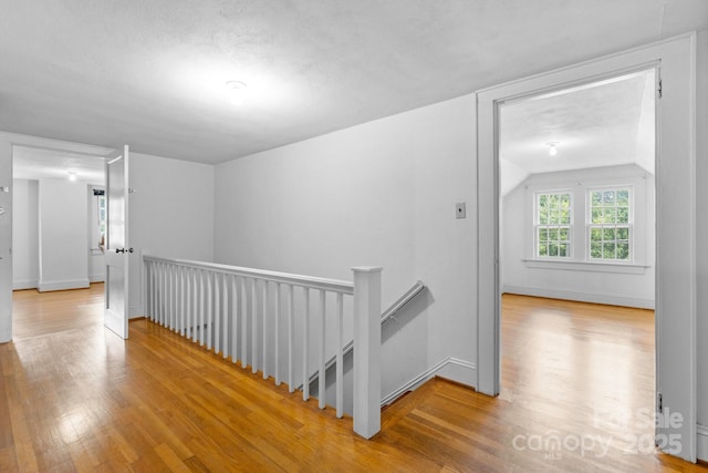 1520 21st Ave NE, Hickory, NC 28601 - corridor featuring an upstairs landing, wood finished floors, and vaulted ceiling