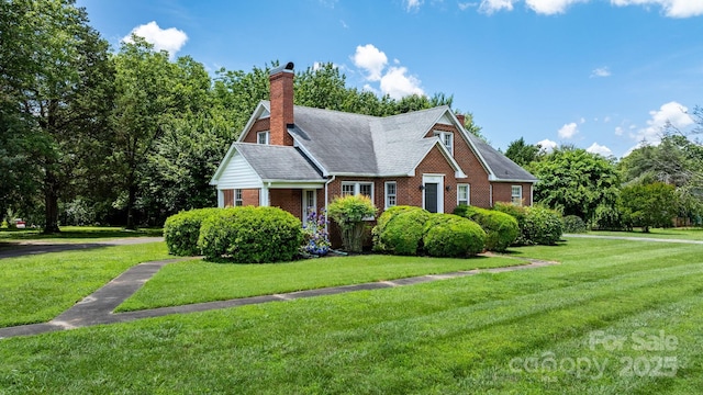 1520 21st Ave NE, Hickory, NC 28601 - view of front facade featuring a front yard, brick siding, and a chimney