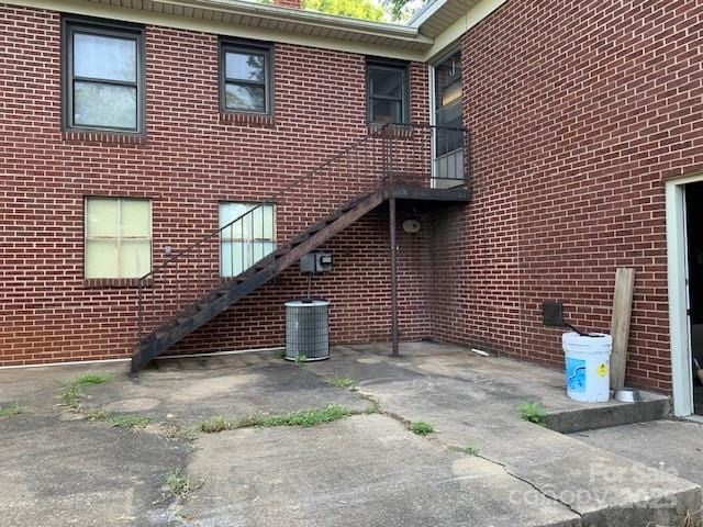 209 8th Ave NW, Hickory, NC 28601 - view of home's exterior with brick siding and a patio