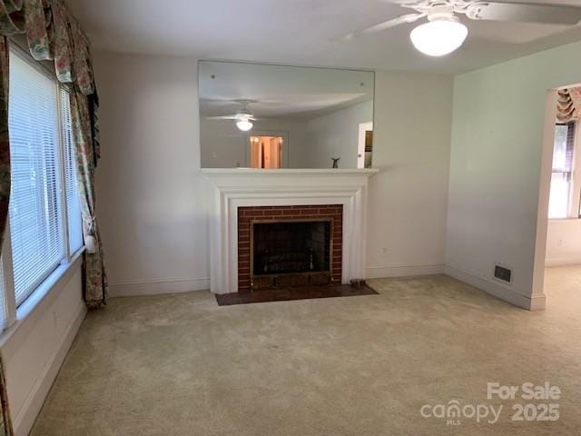 209 8th Ave NW, Hickory, NC 28601 - unfurnished living room with a ceiling fan and carpet flooring