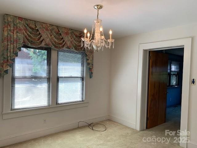 209 8th Ave NW, Hickory, NC 28601 - unfurnished dining area featuring light colored carpet and a chandelier