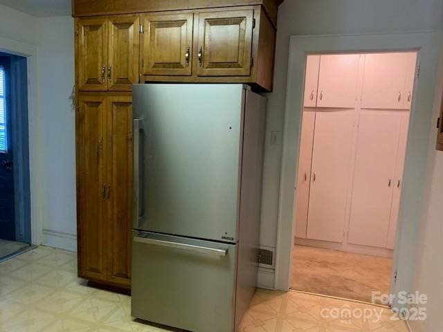 209 8th Ave NW, Hickory, NC 28601 - kitchen with freestanding refrigerator and light floors