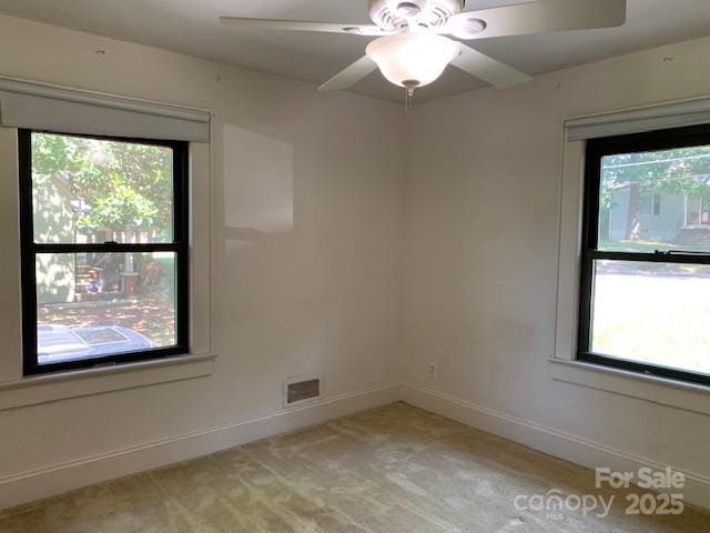 209 8th Ave NW, Hickory, NC 28601 - unfurnished room with healthy amount of natural light, light carpet, and ceiling fan