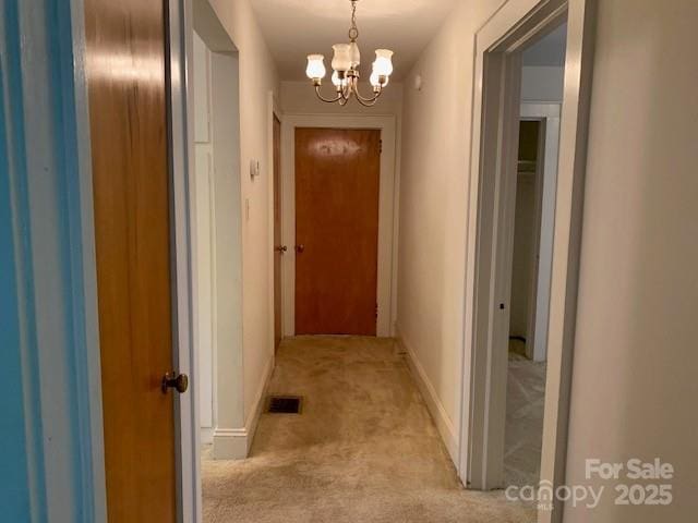 209 8th Ave NW, Hickory, NC 28601 - corridor featuring a chandelier and light colored carpet
