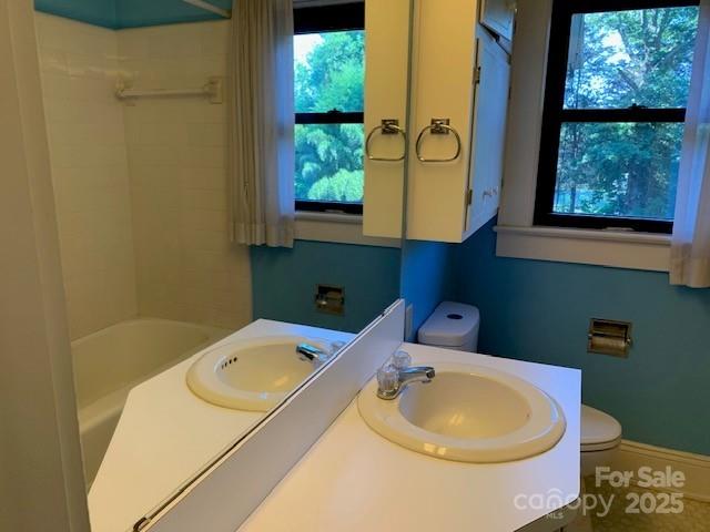 209 8th Ave NW, Hickory, NC 28601 - bathroom with vanity, plenty of natural light, and shower / bath combination