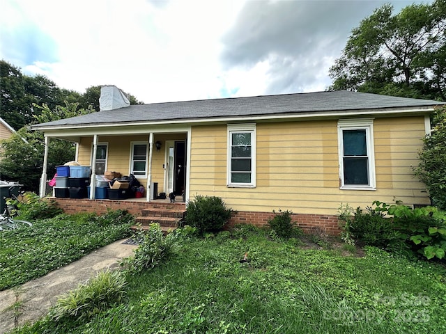 3396 Farm Lake Dr SW, Concord, NC 28027 - ranch-style home with covered porch and a chimney