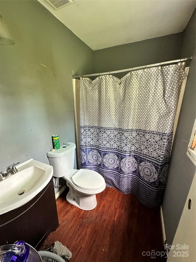 3396 Farm Lake Dr SW, Concord, NC 28027 - bathroom featuring wood finished floors, vanity, and curtained shower