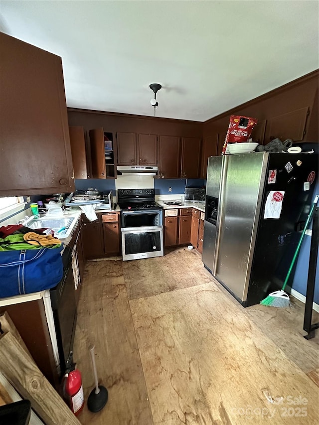 3396 Farm Lake Dr SW, Concord, NC 28027 - kitchen featuring stainless steel appliances, under cabinet range hood, light countertops, and dark brown cabinetry