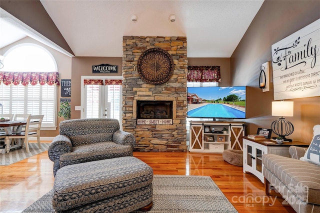 116 Camille Dr, Shelby, NC 28150 - living room featuring vaulted ceiling, healthy amount of natural light, wood finished floors, and french doors