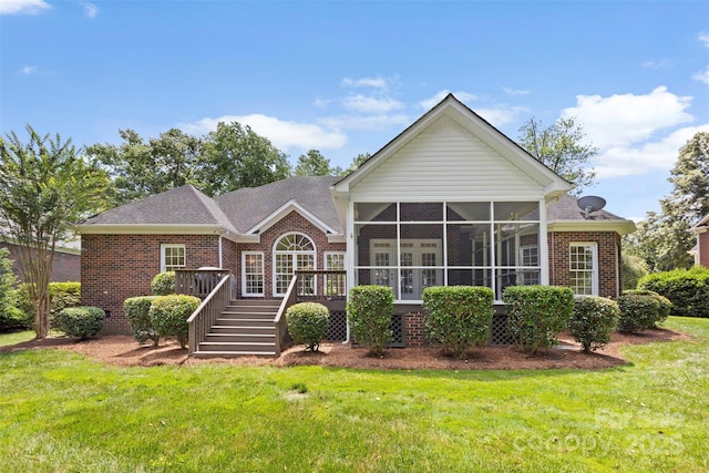 2241 Flagstick Dr, Matthews, NC 28104 - view of front of house featuring brick siding, a front yard, a deck, a sunroom, and stairway