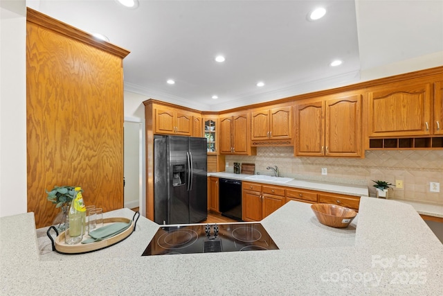 2241 Flagstick Dr, Matthews, NC 28104 - kitchen with black appliances, light countertops, tasteful backsplash, recessed lighting, and ornamental molding