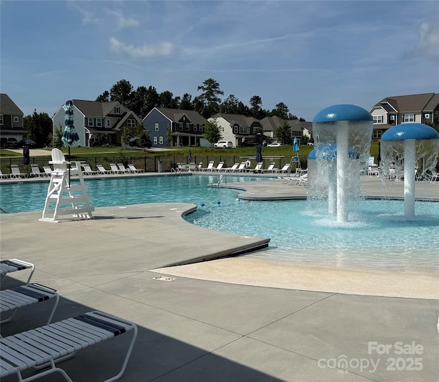 169 Rooster Tail Ln, Troutman, NC 28166 - community pool featuring a residential view, a patio area, and a water play area