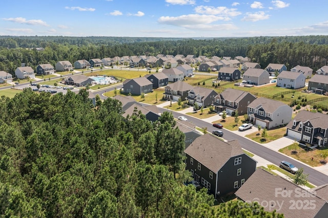 169 Rooster Tail Ln, Troutman, NC 28166 - aerial perspective of suburban area with a heavily wooded area