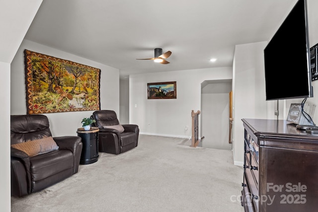169 Rooster Tail Ln, Troutman, NC 28166 - living area featuring an upstairs landing, light carpet, and ceiling fan