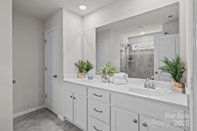 169 Rooster Tail Ln, Troutman, NC 28166 - full bathroom featuring double vanity and a shower stall