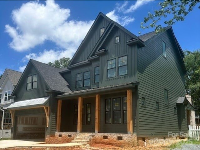 427 Greystone Rd, Charlotte, NC 28209 - view of front of property with a porch, board and batten siding, crawl space, an attached garage, and concrete driveway