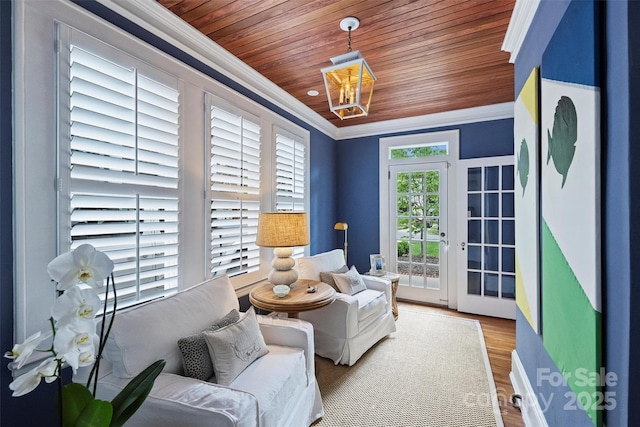 726 E Kingston Ave, Charlotte, NC 28203 - sitting room with ornamental molding, wood finished floors, wood ceiling, and a chandelier