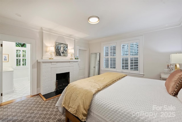 726 E Kingston Ave, Charlotte, NC 28203 - bedroom featuring ornamental molding, wood finished floors, and a brick fireplace