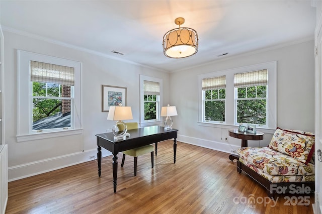 726 E Kingston Ave, Charlotte, NC 28203 - home office featuring plenty of natural light, wood finished floors, and ornamental molding