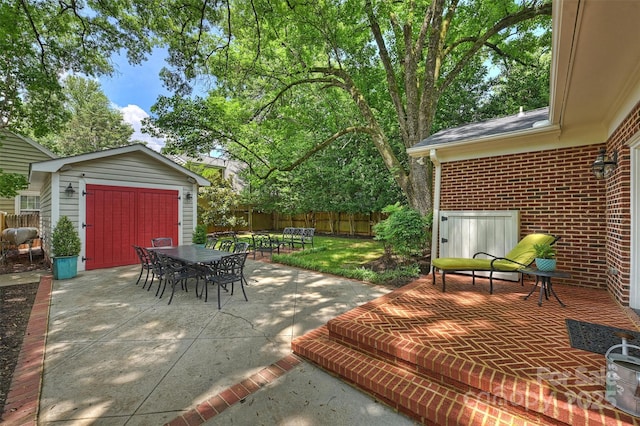 726 E Kingston Ave, Charlotte, NC 28203 - view of patio featuring outdoor dining space and a storage unit