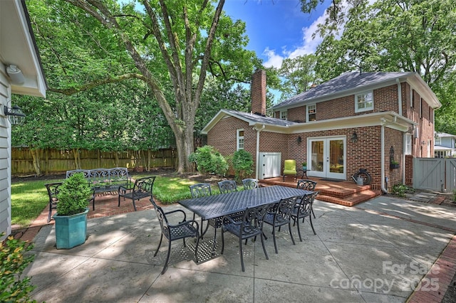 726 E Kingston Ave, Charlotte, NC 28203 - fenced backyard featuring french doors, outdoor dining area, a patio area, and a gate