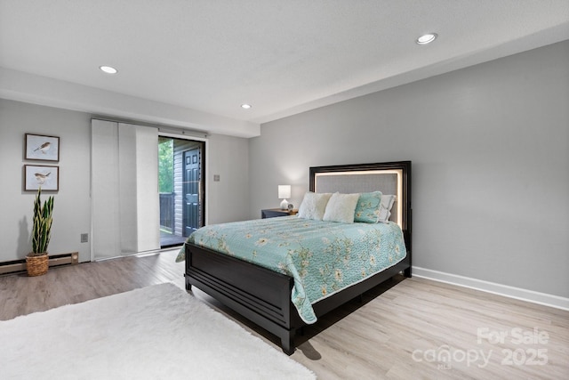 5192 Corbin Ln, Hickory, NC 28601 - bedroom featuring access to exterior, wood finished floors, recessed lighting, and baseboard heating