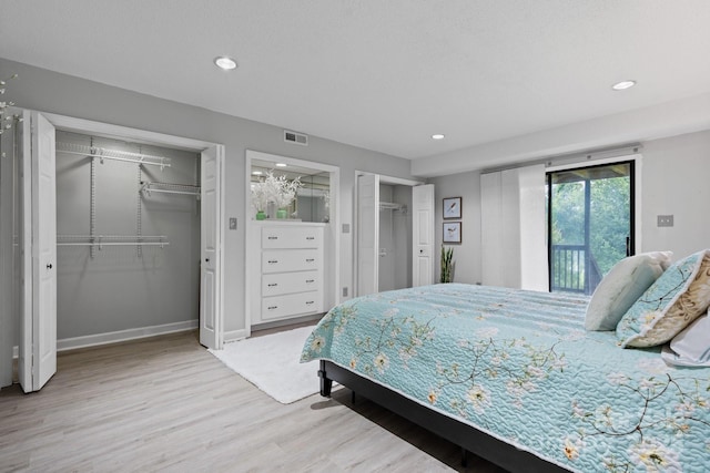 5192 Corbin Ln, Hickory, NC 28601 - bedroom featuring multiple closets, wood finished floors, recessed lighting, and access to exterior