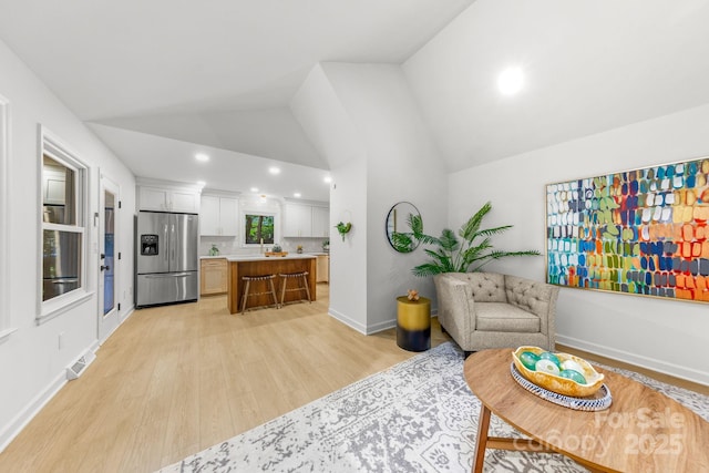 3519 Campbell Dr, Charlotte, NC 28205 - living area featuring light wood-style floors, recessed lighting, and high vaulted ceiling