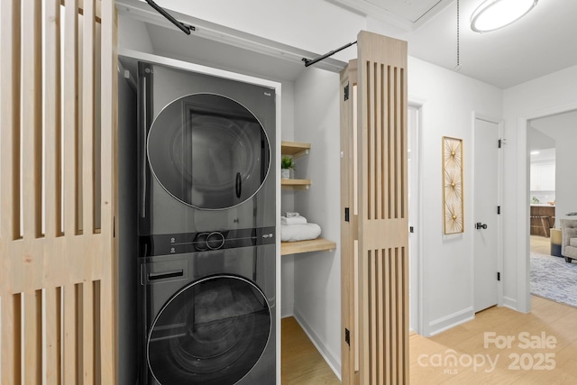 3519 Campbell Dr, Charlotte, NC 28205 - washroom with stacked washer / drying machine and wood finished floors
