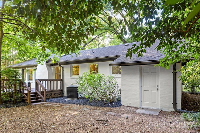 3519 Campbell Dr, Charlotte, NC 28205 - back of property with brick siding, roof with shingles, and a deck
