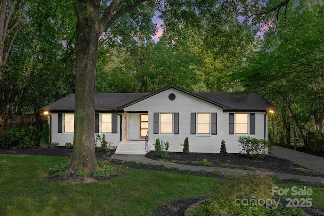 3519 Campbell Dr, Charlotte, NC 28205 - ranch-style home with a yard and a shingled roof