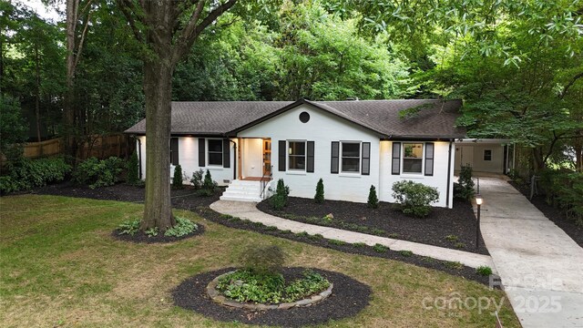 3519 Campbell Dr, Charlotte, NC 28205 - ranch-style home with driveway, a shingled roof, an attached carport, and stucco siding