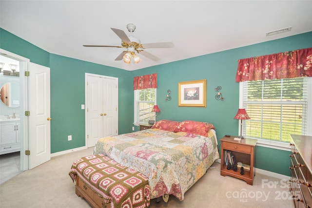 220 Holmes Ct, Concord, NC 28027 - bedroom featuring light colored carpet, a closet, ceiling fan, and connected bathroom