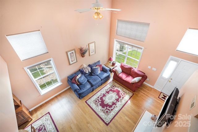 220 Holmes Ct, Concord, NC 28027 - living area featuring a high ceiling, wood finished floors, and ceiling fan