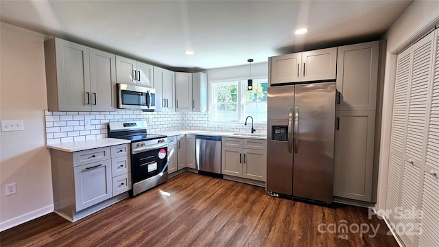 703 Central Dr NW, Concord, NC 28027 - kitchen with stainless steel appliances, dark wood-style floors, light countertops, gray cabinets, and recessed lighting