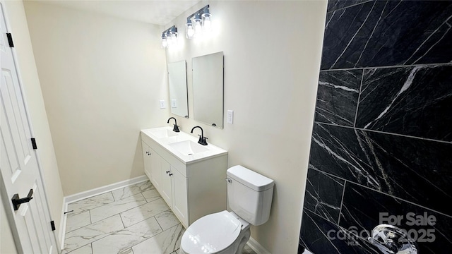 703 Central Dr NW, Concord, NC 28027 - bathroom with marble finish floors and double vanity