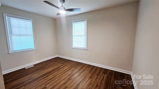 703 Central Dr NW, Concord, NC 28027 - unfurnished room with dark wood finished floors and a ceiling fan