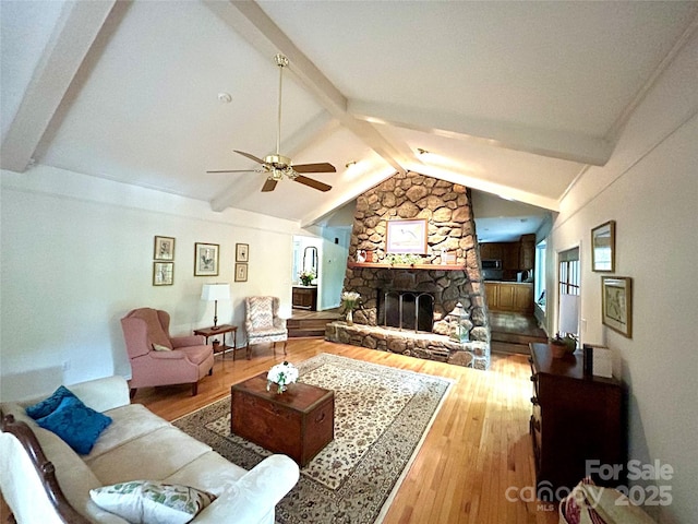 143 Uwharrie Ct Unit 1080, 1081, Mount Gilead, NC 27306 - living area featuring wood finished floors, ceiling fan, a fireplace, and plenty of natural light