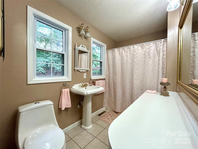 143 Uwharrie Ct Unit 1080, 1081, Mount Gilead, NC 27306 - bathroom featuring a textured ceiling and tile patterned floors