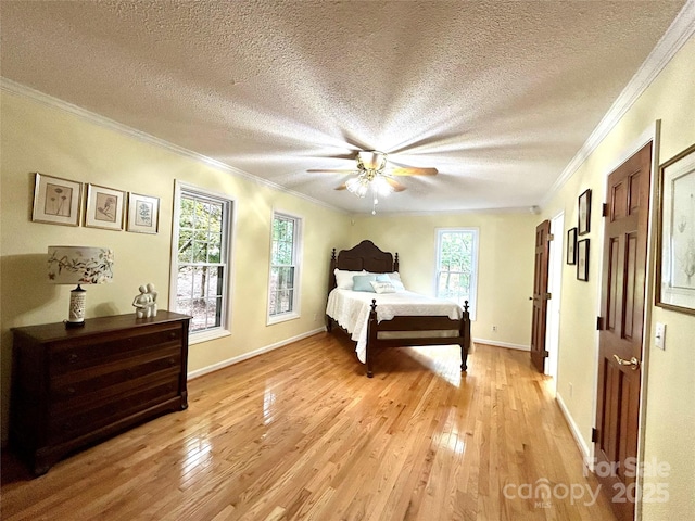 143 Uwharrie Ct Unit 1080, 1081, Mount Gilead, NC 27306 - bedroom featuring light wood-type flooring, a textured ceiling, ornamental molding, and ceiling fan