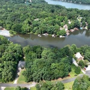 143 Uwharrie Ct Unit 1080, 1081, Mount Gilead, NC 27306 - aerial view of property and surrounding area with a large body of water and a forest
