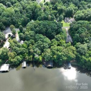 143 Uwharrie Ct Unit 1080, 1081, Mount Gilead, NC 27306 - aerial view of a large body of water and a heavily wooded area