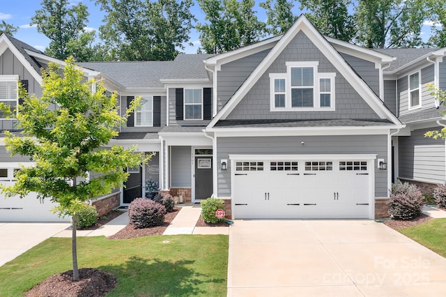 6365 Ashton Park Dr, Denver, NC 28037 - craftsman-style house with concrete driveway, a garage, a front yard, a shingled roof, and stone siding