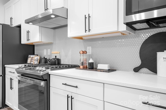 6365 Ashton Park Dr, Denver, NC 28037 - kitchen featuring appliances with stainless steel finishes, exhaust hood, light countertops, and white cabinetry