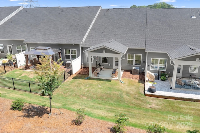 6365 Ashton Park Dr, Denver, NC 28037 - back of house with a patio, a fenced backyard, a gazebo, and roof with shingles