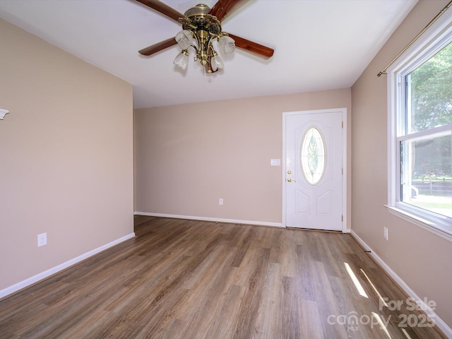 618 Springfield Dr NW, Concord, NC 28027 - foyer entrance featuring plenty of natural light, wood finished floors, and ceiling fan