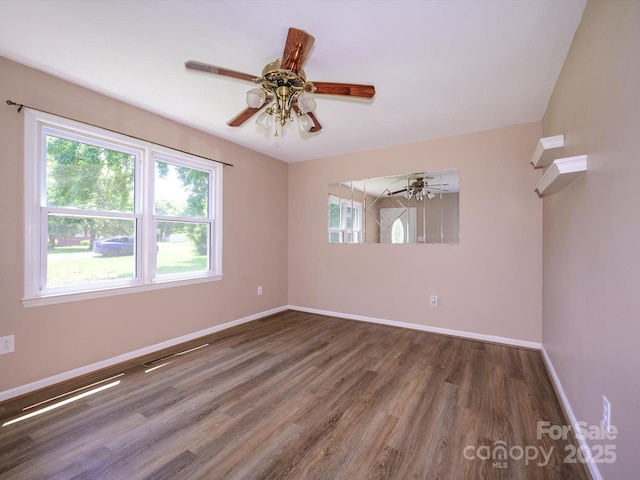 618 Springfield Dr NW, Concord, NC 28027 - empty room featuring wood finished floors and ceiling fan