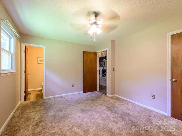 618 Springfield Dr NW, Concord, NC 28027 - unfurnished bedroom with separate washer and dryer, carpet flooring, connected bathroom, a closet, and a ceiling fan