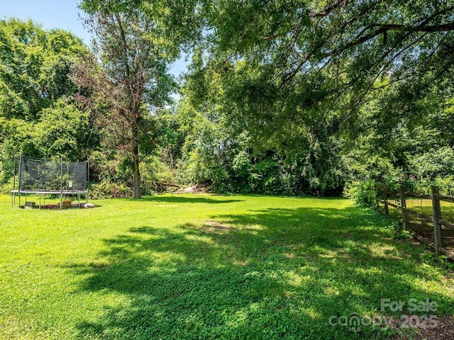 618 Springfield Dr NW, Concord, NC 28027 - view of yard with a trampoline